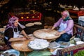 Two Turkish women making traditional flatbread, lavash, in Istanbul