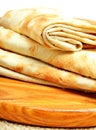Lavash, tortilla wrap Bread on the cutting board on white Royalty Free Stock Photo