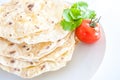 Pita bread on a white background with a tomato Royalty Free Stock Photo