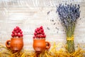 Laveder composition with jar, cup, raspberry on rustic background top view mock-up