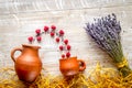 laveder composition with jar, cup, raspberry on rustic background top view mock-up