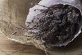 Lavender bouquet wrapped in sackcloth on wooden background Royalty Free Stock Photo