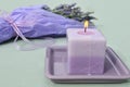 Lavender candle and flower bouquet Royalty Free Stock Photo