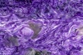 Lavender charoite mineral texture with swirling white streaks and pearly luster. Natural stone from Russia Royalty Free Stock Photo