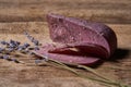 Lavender cheese with twigs of fresh lavender flowers on rough wooden planks Royalty Free Stock Photo