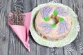 Lavender Cupcake. Sugar coated. Decorated with lavender glaze flowers. Near a bouquet of lavender