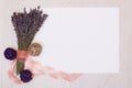 Lavender desk with flowers on background top view mock up.White paper postcard Royalty Free Stock Photo