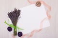 Lavender desk with flowers on background top view mock up.White paper postcard Royalty Free Stock Photo