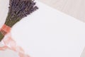 Lavender desk with flowers on background top view mock up.White paper postcard Royalty Free Stock Photo