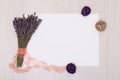Lavender desk with flowers on background top view mock up.White paper postcard Royalty Free Stock Photo