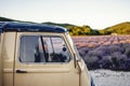 Lavender field in summer sunny day with retro car on first plan Royalty Free Stock Photo