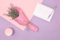 Lavender flower bouquet, cosmetic jar and open empty notebook. Women lifestyle minimal concept Royalty Free Stock Photo