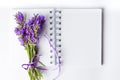 Lavender flowers bouquet on open notebook Royalty Free Stock Photo