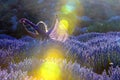 Lavender flowers and lady in fields at sunset. Sunrise light over purple flowers of lavender in Kuyucak, Isparta, Turkey.