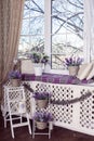 Lavender flowers in white pots, wicker baskets and small bicycle stand on wooden ladder. Royalty Free Stock Photo