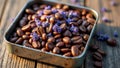 Lavender-infused coffee beans in metal tray on wooden surface Royalty Free Stock Photo