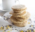 Lavender and lemon sshrtbread cookies on parchment paper and coffee cup Royalty Free Stock Photo