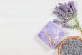 Lavender natural soap with fresh lavender flowers and dried lavender seeds on white rustic table Royalty Free Stock Photo