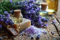 Lavender, oil essence, handmade soap and sea salt on a wooden background. Royalty Free Stock Photo