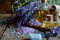 Lavender, oil essence, handmade soap and sea salt on a wooden background. Royalty Free Stock Photo