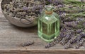 Lavender oil with fresh flowers on wooden background. Vintage st Royalty Free Stock Photo