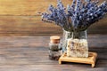 lavender oil and salt in glass bottle on background of dry lavender flowers. Natural cosmetic Royalty Free Stock Photo