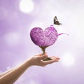 Lavender purple ribbon all kind of cancer awareness on heart tree with butterfly on volunteer`s hand for medical charity campaign Royalty Free Stock Photo