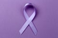 Lavender ribbon on color background.