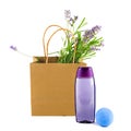 Lavender shampoo (shower gel) and a bouquet of lavender flowers in a paper bag isolated on a white . Collage