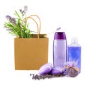 Lavender shampoo (shower gel), soap and a bouquet of lavender flowers in a paper bag isolated on a white. Collage