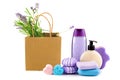 Lavender shampoo (shower gel), soap and a bouquet of lavender flowers in a paper bag isolated on a white . Collage