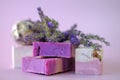 Lavender Soap and Bath Bombs, sprigs of lavender on a light purple background. vegan cosmetics concept. Organic herbal Royalty Free Stock Photo