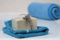 Lavender soap on washcloth and rolled blue towel in t Royalty Free Stock Photo