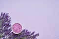 Lavender SPA. Lavender flowers and bath salt in bowl on lilac backdrop. Copy space, top view. SPA concept