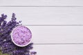 Lavender SPA. Lavender flowers and bath salt in bowl on white wooden background. Copy space, top view. SPA concept Royalty Free Stock Photo