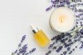 Lavender spa. Lavender natural essential oil, aromatic candle and fresh lavender Royalty Free Stock Photo