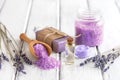 Lavender spa products on an old white wooden table. Body care products with lavender-oil, salt, cream, soap and dried lavender Royalty Free Stock Photo