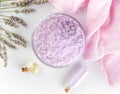 Lavender spa setting: salt, essential oil and dried flowers natural spa products and decor for bath on light background