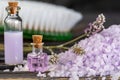 Lavender spa setting: salt, essential oil and dried flowers natural spa products and decor for bath on light background Royalty Free Stock Photo