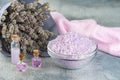 Lavender spa setting: salt, essential oil and dried flowers natural spa products and decor for bath on light background Royalty Free Stock Photo