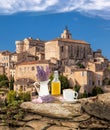 Lavender still life with cup of coffee against Gordes village in Provence, France