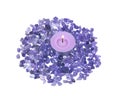 Lavender tea light candle surrounded by amethyst small tumbled chips