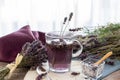 Lavender tea rustic on wood in a glass teacup.