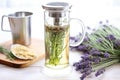 lavender tea steeping in glass tea infuser