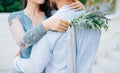 Lavender Wedding bouquet in hands of the bride in white-blue dre