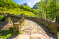 Double arch stone bridge at Ponte dei Salti with waterfall, Lavertezzo, Verzascatal, Ticino.