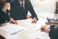 Lawyer and attorney having team meeting at law firm.