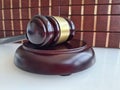 Law book with judges wooden gavel in courtroom or law enforcement office Royalty Free Stock Photo