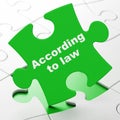 Law concept: According To Law on puzzle background Royalty Free Stock Photo