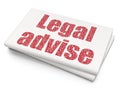 Law concept: Legal Advise on Blank Newspaper background Royalty Free Stock Photo